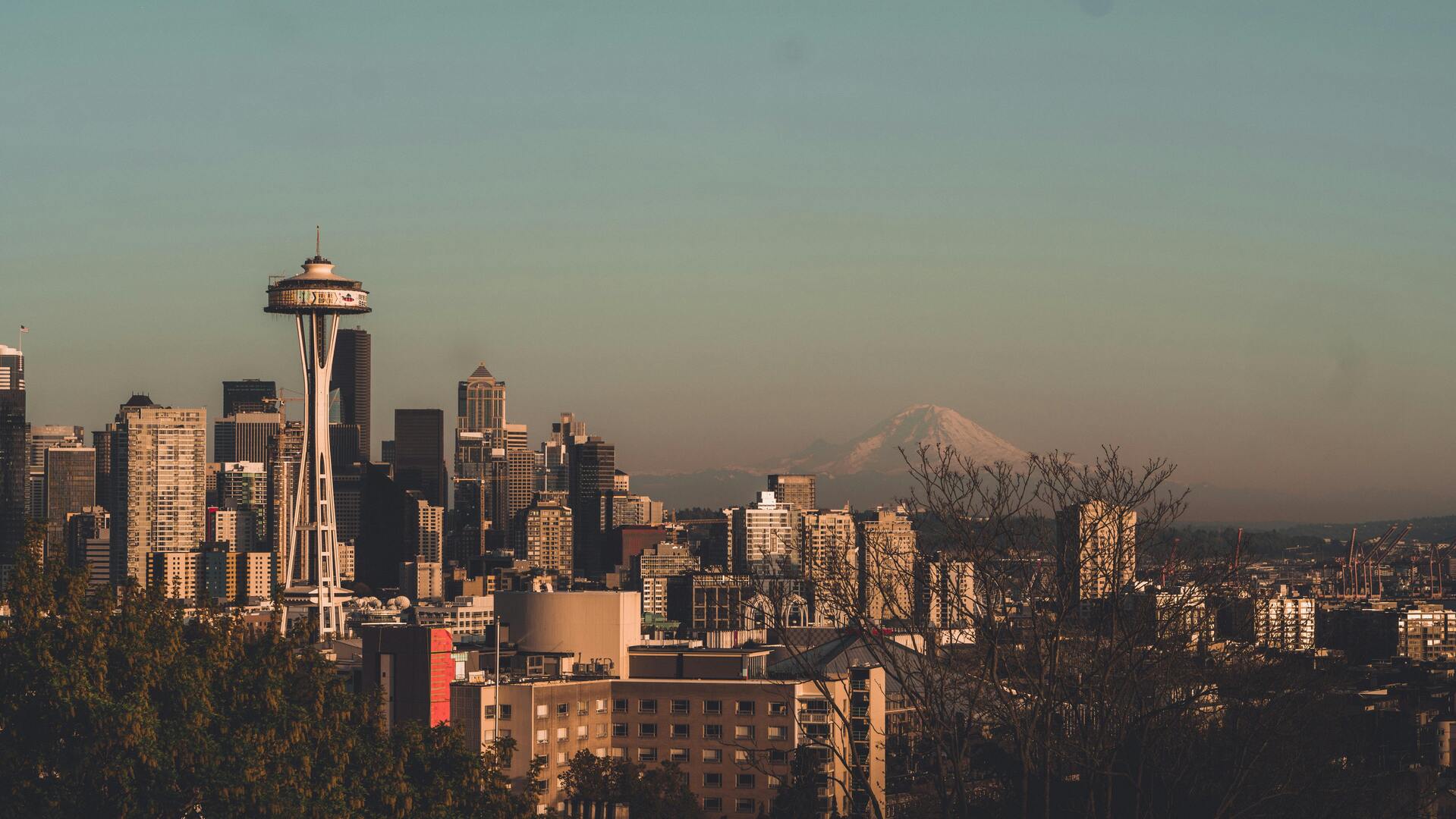 Space Needle observation tower with Seattle skyline and Mount Rainier